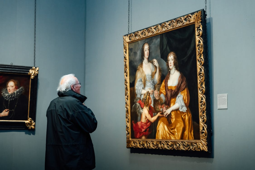 A man standing in an art gallery, closely observing a framed painting