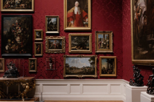 Modern art gallery interior displaying paintings and curated artwork on the walls