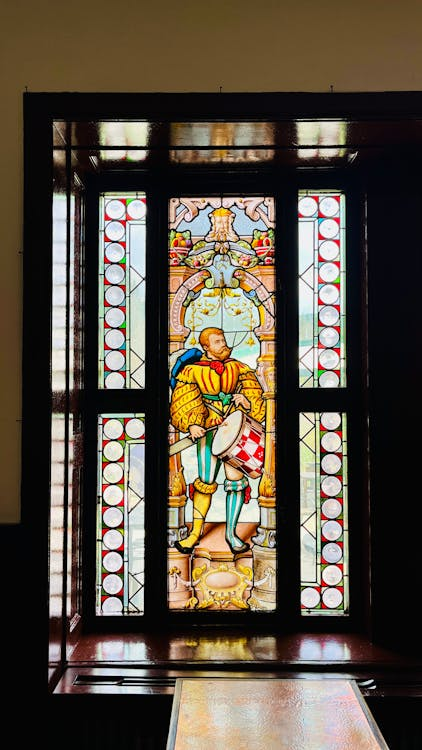Stained glass door at a historic church featuring detailed colorful designs