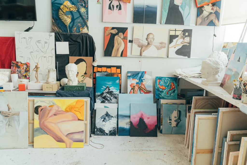 Professional reviewing artwork for appraisal documentation.
